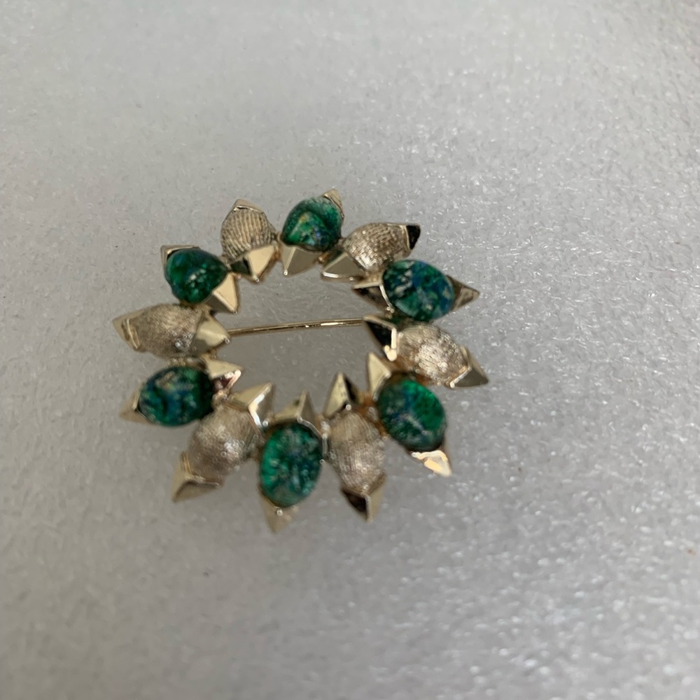 11 W 30 St gold and green glass vintage brooch